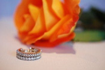 custom wedding ring next to rose