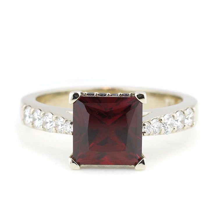 A custom Ruby princess cut engagement ring designed by Abby Sparks Jewelry