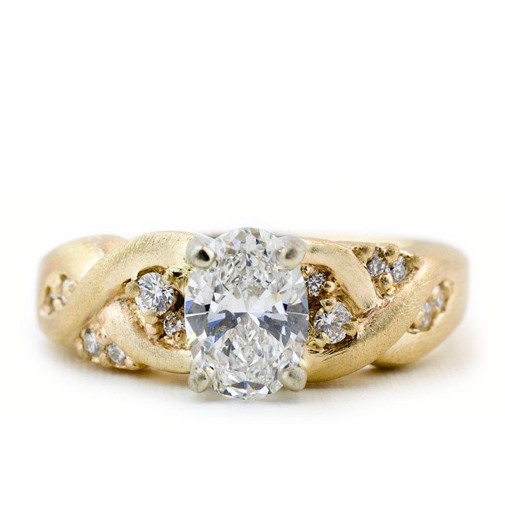 A symbolic braided engagement ring designed for Ashley by Abby Sparks Jewelry