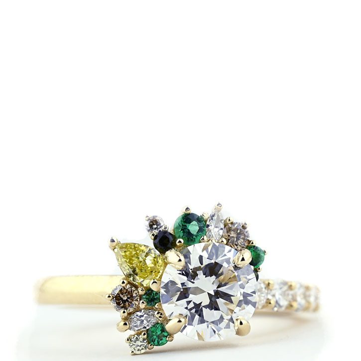The Jane, a custom engagement ring with emerald accents, designed by Abby Sparks Jewelry. 